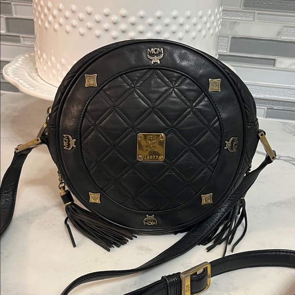 MCM Handbags - MCM Black Quilted Round Crossbody with Gold Hardware